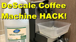 Removing the hot water nozzle from your coffee maker's entrance panel is the first. How To Clean Your Delonghi Nespresso Coffee Machine Without Nespresso Solution Vinegar Youtube