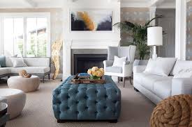 This tufted, square ottoman is a great piece to round out your living room ensemble. Two Tone Wingback Chair With Blue Tufted Ottoman As Coffee Table Transitional Living Room
