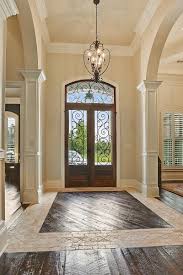 Tile And Wood Floor Double Entry Door Arched Openings To Rooms Troyer Builders Design Your Dream House Wood Floor Design House Entrance