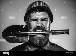 Workman with spade Black and White Stock Photos & Images