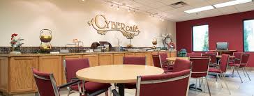 For the interior design of the space, a wooden concept was used in combination with cold materials, so the ambience that was created is modern and warm. Cyber Cafe Manufacturer Business Association