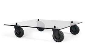 Diy Glass Coffee Table On Wheels Remodelista In 2020 Glass Top Coffee Table Coffee Table With Wheels Glass Coffee Table