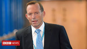 Chansley — who appears in footage from wednesday's chaos pumping his bicep on the dais in the senate chamber — was charged with knowingly entering or remaining in any restricted building or grounds without lawful authority, and with violent entry and disorderly conduct on capitol grounds. Tony Abbott Hacked After Posting Boarding Pass On Instagram Bbc News