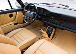 This 1985 porsche 911 coupe comeswith factory tails, rare color combination ofgarnet red exterior and a beige leather interior with a brown dash and surrounds. Interior 1986 89 Porsche 911 Turbo 3 3 Coupe North America 930 1985 89