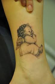 Fantastic angel girls with skull memorial tattoo. Baby Angel Tattoo Design A Precious Tattoo Design For A Baby Boy Body Tattoo Art