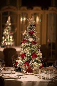 I love the idea of using ladders and decorating it with reds and flowers. 32 Bold Red Winter Wedding Ideas Christmas Wedding Centerpieces Wedding Floral Centerpieces Christmas Wedding Themes