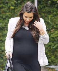 Kim Kardashian Displays Her Baby Bump In A Clingy Dress After Revealing She Wants To Eat Her Own Placenta To Look Younger Kim Kardashian Hair Kardashian Her Hair