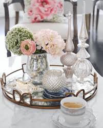 Protect your coffee table while adding a pretty touch with modern coasters. Coffee Table Mirror Tray Styling Floral Mercury Glass Agate Coaster Jonathan Adler Zebra D Coffe Table Decor Decorating Coffee Tables Table Decor Living Room