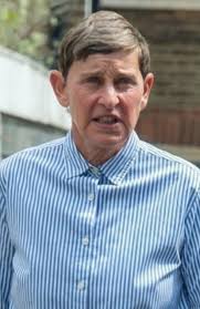 Ellen moved to England and turned into an old British man with big ears