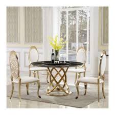 A rug centered beneath the table, a centerpiece on top of the table, and perhaps some wall art or a wall mirror! Affordable Dining Table With Golden Legs Global Sources