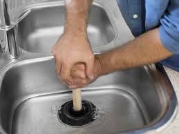 why does my kitchen sink smell like sewage?