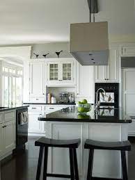 Kashmir white granite countertops with white cabinets. Kitchens With Black Appliances Photos The Birds What A Fun Styling Idea For That Space Abov Black Appliances Kitchen Kitchen Inspirations Kitchen Design