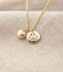 Keep Your Beloved Pets Paw Print Close To Your Heart A Name Can Be Engraved On The Back Of The P Paw Print Pendant Pet Memorial Jewelry Personalized Pendant