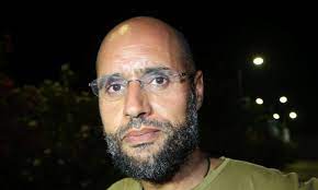 He is the second son of the late libyan leader muammar gaddafi and his second wi. Ø¨Ù„ÙˆÙ…Ø¨ÙŠØ±Øº Ø³ÙŠÙ Ø§Ù„Ø¥Ø³Ù„Ø§Ù… Ø§Ù„Ù‚Ø°Ø§ÙÙŠ ÙŠÙ†ØªØ¸Ø± Ø§Ù„Ø¹ÙˆØ¯Ø© ÙˆÙŠØ±ÙƒØ² Ø¹Ù„Ù‰ Ø§Ù„Ø¥ÙØ±Ø§Ø¬ Ø¹Ù† Ø´Ù‚ÙŠÙ‚Ù‡ ÙˆÙ‚Ø§Ø¯Ø© Ø§Ù„Ù†Ø¸Ø§Ù… Ø§Ù„Ø³Ø§Ø¨Ù‚ Ø§Ù„Ù‚Ø¯Ø³ Ø§Ù„Ø¹Ø±Ø¨ÙŠ