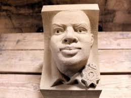 Carving student's cat corbel in Evening Standard