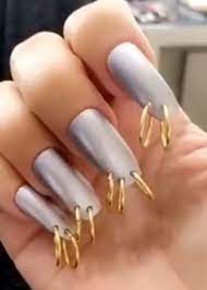 another bizarre nail trend pierced nails pierced nails kim kardashian nails nail piercing
