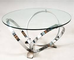 This elegant coffee table features a tempered glass top and a sophisticated silver base with a geometric design. Modern Round Glass Coffee Table Round Glass Coffee Table Glass Coffee Table Metal Base Coffee Table