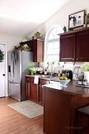 The less expensive project is to paint the cabinets. Crushing On My Favorite Things April Cherry Cabinets Kitchen Kitchen Remodel Kitchen Colors