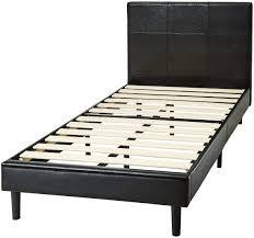 When folded down, it is compact and can be stowed away easily. Amazon Com Amazon Basics Faux Leather Upholstered Platform Bed Frame With Wooden Slats Twin Home Kitchen