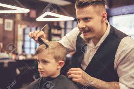 You need to pick the best hairdo for your child which suits him and provides him an impressive character. Cute Little Boy Is Getting Haircut By Hairdresser At The Barbershop Stock Photo Picture And Royalty Free Image Image 69608068