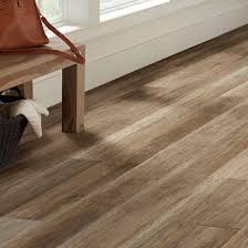 Waterproof vinyl flooring is available in a wide range of wood and stone designs. Flooring The Home Depot