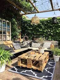 small backyard garden with bluestone tiles artificial grass and lots of evergreens backyard patio design backyard patio designs backyard decor