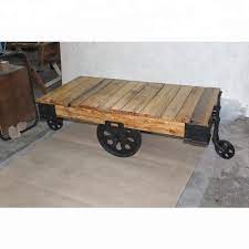 Cart does sit flat on the ground but will need to add block at the other side to. Vintage Industrial Cart Table With Cast Iron Wheels Cart Coffee Table Buy Vintage Industrial Cart Table With Cast Iron Wheels Solid Wood Top Table With Wheels Wooden Table With Wheels Product On Alibaba Com