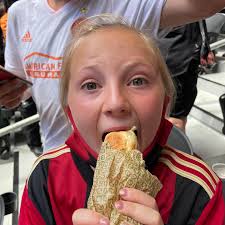 Celia caught a hot dog thrown into the crowd...and we danced and cheered