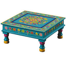 Made of metal, the occasional table stands on rounded tapered legs and features three removable trays. Indian Hand Painted Furniture Homify