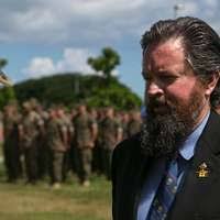 Wounded veterans pay their respects to the U.S. flag