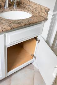 White bathroom cabinet doors and drawer fronts. Our Painted Bathroom Vanity The Before After And How To Guide Driven By Decor