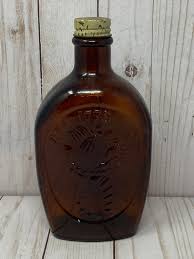Vintage log cabin bottles syrup flask 1776 bicentennial amber eagle bell no caps. Pin On Gphd130 Golden Treacle
