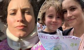 Missy Higgins wears a neck brace after her son 'ran at her head while she  was sitting