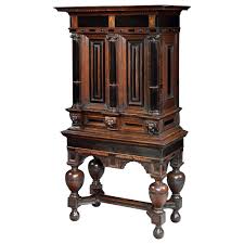 A simple lock that opens with a key, similar to the mechanisms used on fireproof lock boxes, would be ideal for a cabinet like this. Cabinet On Stand Dutch Renaissance Oak Ebonised Secret Locking Mechanism Key For Sale At 1stdibs