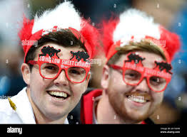 England fans smile ahead of the Rugby World Cup Pool A match between  England and Uruguay at Manchester City Stadium, Manchester, England,  Saturday, Oct. 10, 2015. (AP Photo/Jon Super Stock Photo