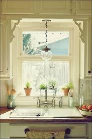 Romans can easily be dressed up with a matching valance for an extra uumph of design. Kuchenfenster Inspiration Kuche Deko Kitchen Sink Lighting Kitchen Sink Window Farmhouse Sink Kitchen