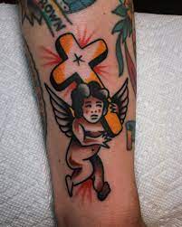 Cross tattoos are usually associated with religion. Traditional Angel With A Cross Tattoo Tattoogrid Net