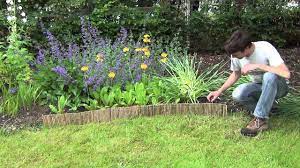 Bamboo edging and bordering is cheap and very affordable. Bamboo Lawn Edging Roll Youtube