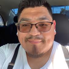 I'm so wanting this El Grande Americano to be unmasked to a point that I  would wager my own mullet in a match against him for it to happen. So how  about