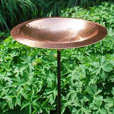 Water capacity is approximately 1/2 gallon. Duncraft Com Hammered Copper Bird Bath With Stake
