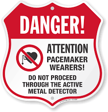 If you're using a particular magnet in your product, do you need to be concerned? Pacemaker Wearers Do Not Proceed Through Metal Detector Sign