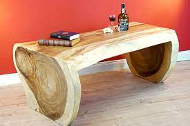 Coffee table shows beautiful live edges with natural knots and movement of the wood. Asian Furniture Tree Trunk Coffee Table Mae Hong Kinaree