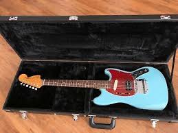 One guitar pick has a picture of kurt cobain in a green sweater and the other pick has. Kurt Cobain Sonic Blue Fender Mustang Left Handed W Tremolo Kurt Cobain Mustang Guitar Electric Guitar For Sale