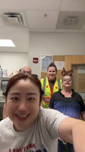 Woman Dancing to Chicken Head with Chicken Hanging Off of Her