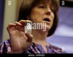 Registered Nurse Babette Richter, with the South Jersey AIDS Alliance,  holds up a container of the heroin overdose antidote, naloxone in Camden,  N.J.