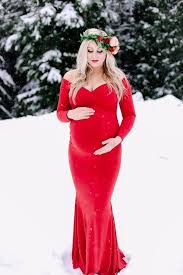 Red Dress Maternity Shoot In The Snow Winter Photography Floral Crown Sophisticated Flora Winter Maternity Photos Red Maternity Dress Winter Maternity Pictures