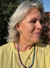 Contrasting yellow outfits with snake chain necklaces