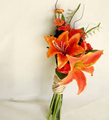 Use roses, calla lilies, even celosias to create orange wedding bouquets. Bridal Bouquet Fall Weddings Orange Tiger Lillies Bridal Bouquet Fall Lily Bouquet Wedding Orange Bridal Bouquet