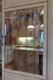 Dura supreme cabinetry design by megan dent, akbd of. 16200 Morningside Dr Muirfield Village Kitchen Mirror Pantry Door Mirrored Cabinet Doors