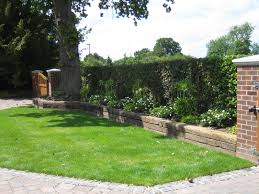 Railway sleeper retaining walls are great alternatives to using bricks, concrete or stone. Pin By Sue Davis On Hard Landscaping Materials And Ideas Driveway Landscaping Beautiful Gardens Garden Design